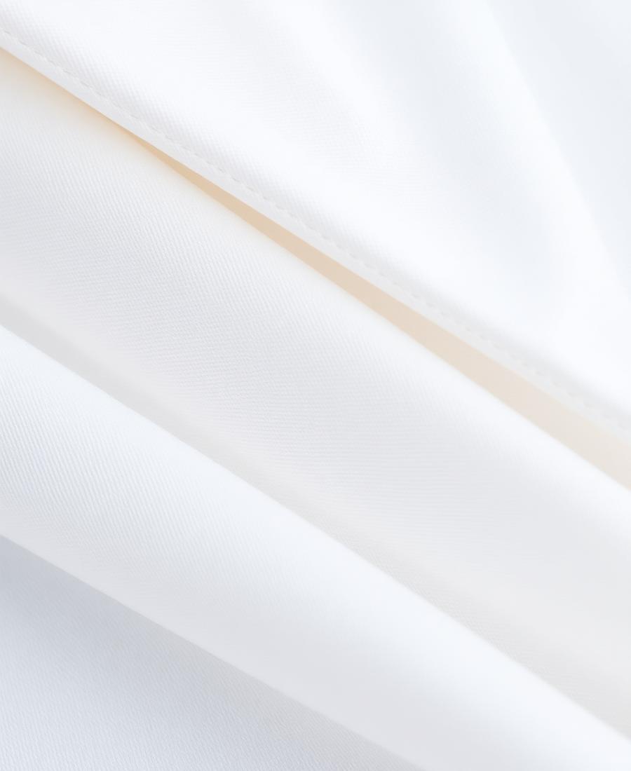 Folded white and pale blue cotton shirting fabric available in Dubai
